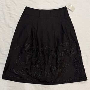 Black A-Line Skirt - Pleats, Ribbon Detailing and Sequins.